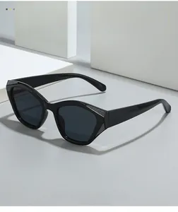Detail of black geometric cat-eye sunglasses with silver textured hinges and grey lenses