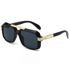 Classic retro square sunglasses with black frame and gold metal accents on white background
