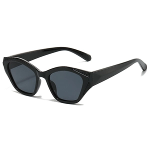 Fashionable black cat-eye sunglasses with textured corners and dark grey lenses for women