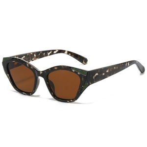 Fashion cat-eye sunglasses with tortoiseshell frame and green glitter accent on temples