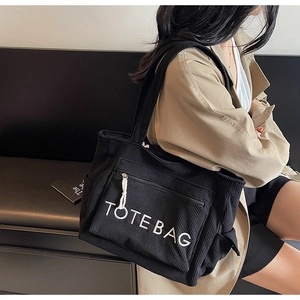 Schwarze Cord-Einkaufstasche mit TOTE BAG Bestickung und Reißverschluss-Fronttasche