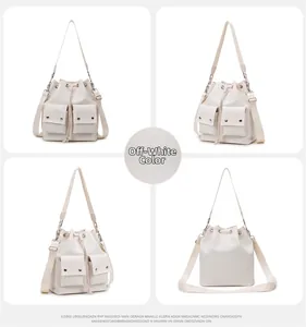 Detailed view of cream-colored nylon bucket bag with drawstring closure and cargo pockets