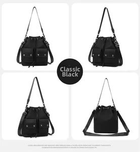 Detail view of black nylon bucket bag with drawstring closure and functional utility pockets