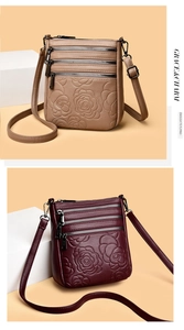 Close-up of embossed rose texture on multi-zippered crossbody bucket bags