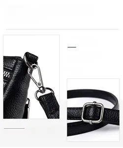 Detailed close-up of premium silver hardware and litchi grain leather on a black bucket bag