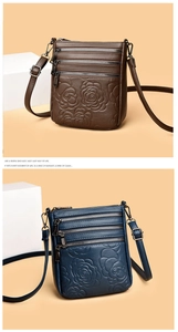Detailed view of embossed rose patterns and multi-zipper layers on PU leather bags