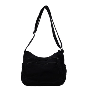 Versatile black multi-pocket canvas tote bag with adjustable strap for daily commute