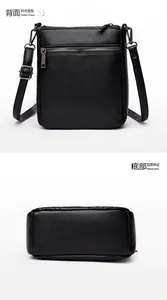 Detail showing the back zipper pocket and base structure of black lychee leather bag