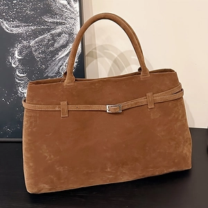 Classic brown suede tote bag with decorative leather strap and silver buckle detail