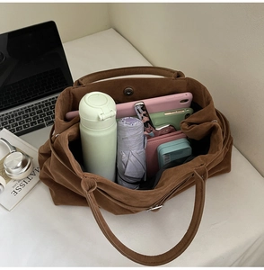 Spacious brown faux suede tote bag showing large capacity for daily essentials