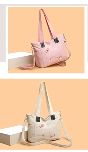 Detail of corduroy tote bags with flower embroidery and adjustable shoulder straps