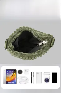 Detailed interior view of large capacity corduroy crossbody bag with daily essentials