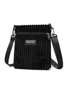 Detail of black corduroy crossbody bag with adjustable strap and front zipper pocket