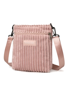 Pink corduroy crossbody bag detail showing zipper pocket and adjustable strap
