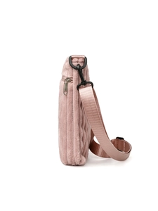 Detail of pink corduroy shoulder bag showing soft ribbed texture and adjustable strap