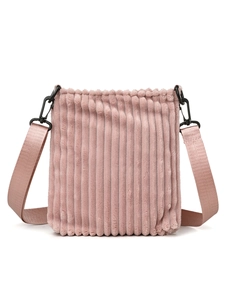 Detailed shot of pink corduroy shoulder bag with soft vertical stripes and wide nylon strap