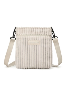 Detail of off-white corduroy shoulder bag with front zipper and Perfect Lily logo tag
