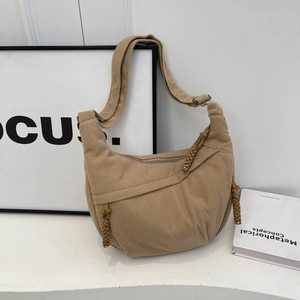 Sac bandoulière en velours côtelé kaki avec large sangle et tirette de fermeture tissée