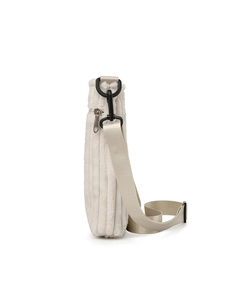Detail of cream corduroy crossbody bag showing soft plush texture and black D-ring buckle