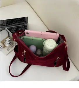 Interior view showing the large capacity of a burgundy tote bag with daily essentials