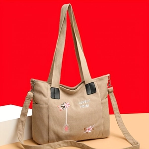 Corduroy tote bag with floral embroidery and adjustable straps in beige and pink finish