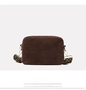 Back view of dark brown square crossbody bag with patterned jacquard wide strap