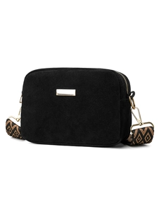 Detail of matte black crossbody camera bag featuring a wide geometric woven shoulder strap