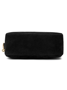 Detail view of the black matte textured crossbody bag showing golden metal D-ring attachment