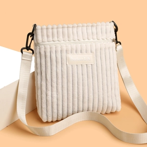 Minimalist cream corduroy crossbody bag with adjustable strap and Perfect Lily patch