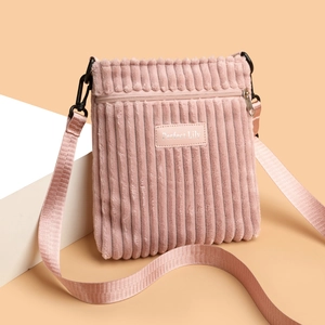 Pink corduroy crossbody bag for women with minimalist shoulder strap and texture