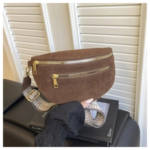Brown suede saddle bag detail with ethnic patterned wide strap and gold zip accents