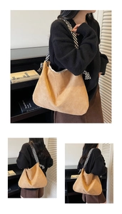Detail of khaki suede tote bag with black and white striped woven shoulder strap