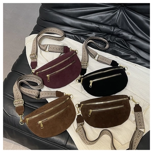 Detail of four matte suede saddle bags with decorative wide ethnic-style straps