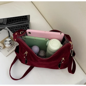 Large burgundy velvet tote interior showing tablet and daily essentials storage capacity