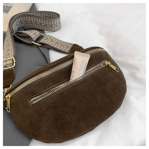 Detail of dark brown faux suede waist bag showing spacious double zip interior storage
