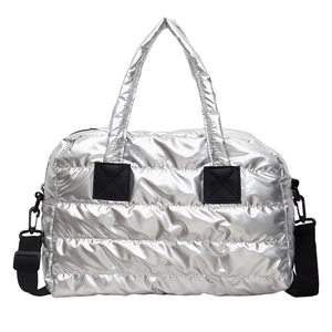 Silver quilted fitness bag with metallic finish and detachable black shoulder strap