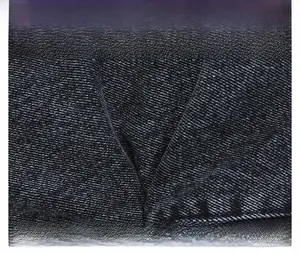 Macro shot of black denim fabric texture with clear diagonal twill pattern for square bag