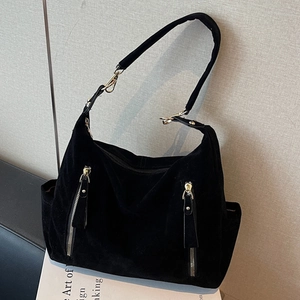Large black faux suede tote bag with gold zippers and hardware for commute