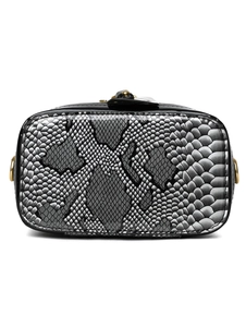 Detail of snake skin texture with black patent leather trim and gold metal hardware