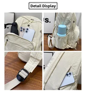 Detailed view of cream nylon backpack featuring multiple utility pockets and adjustment buckles