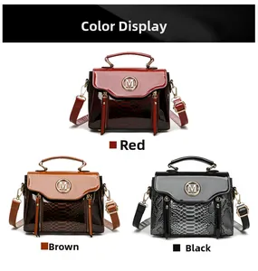 Close-up of three classic colors of leather handbags with metal M logo and snake patterns