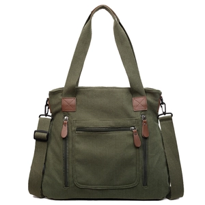 Sac fourre-tout en velours côtelé vert foncé avec accents en cuir et bandoulière réglable