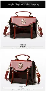Close-up of wine red snake-embossed leather handbag with gold M logo and glossy flap