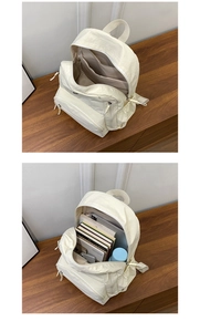 Comparison showing the large capacity of the beige nylon backpack with multiple layers