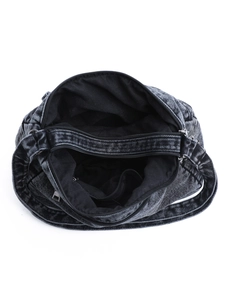 Top view of black washed denim crossbody bag showing multi-layer compartments and lining