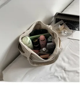 Internal layout of corduroy tote bag showing large capacity with multiple pockets