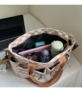 Top view of pink checkerboard tote bag interior showing large capacity and pockets