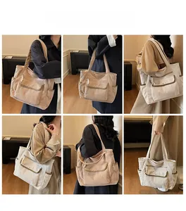 Detail of corduroy tote bag showing multiple pockets and spacious interior for daily use