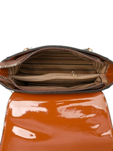 Detail showing the brown patent leather handbag interior with striped lining and zipper compartment
