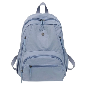 Light blue nylon multi-pocket travel backpack for women with spacious compartments